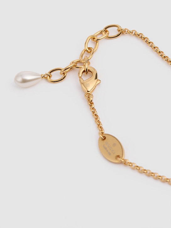 Luisaviaroma Bracciale a catena GG Marmont in ottone con charm Promozione